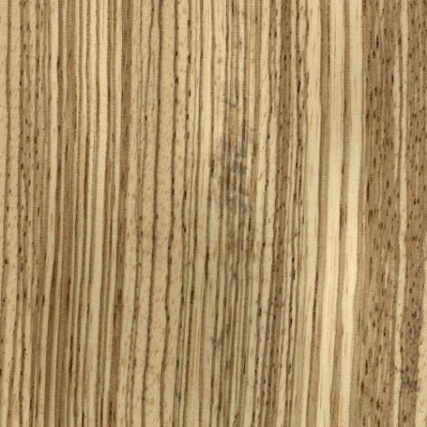 Chapa de madera de cebrano color amarillento con vetas rayadas, parecido al pelaje de una cebra.