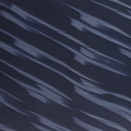 imagen acetato de celulosa color azul con franjas diagonales grisáceas que forman un patrón de olas